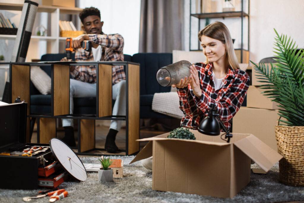 family assembling furniture and unpacking boxes at 2023 11 27 05 19 16 utc